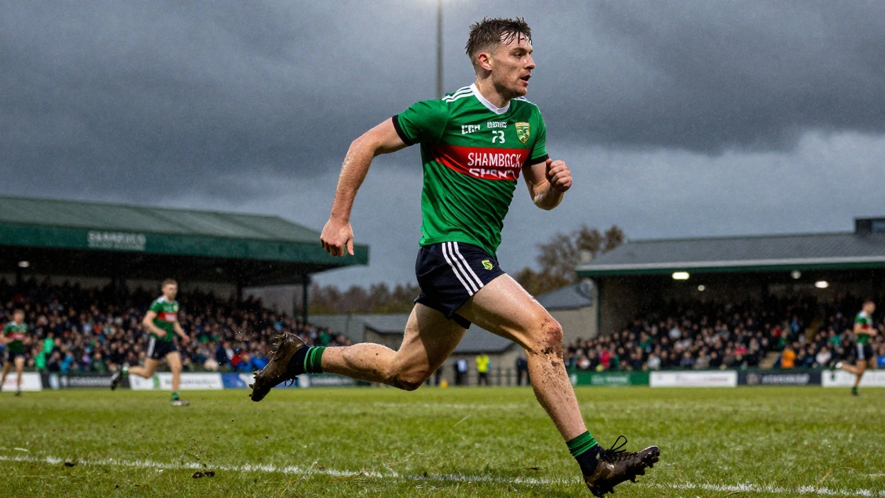 GAA player sprinting on a wet pitch in Ireland wearing technical sportswear with moisture-wicking fabric.